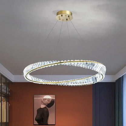 Modern pendant lamp with gold plated steel frame and clear crystal segments for elegant dining room decorbites lighting