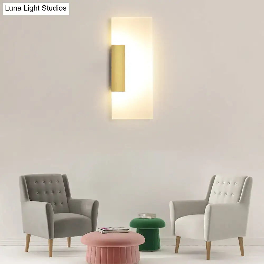 Modern gold rectangular acrylic wall sconce with bulb included featuring a warm glowing light and sleek metal frame