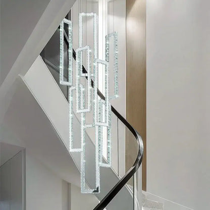 Modern gold rectangular crystal led pendant light with cascading frames suspended above stairs by Decorbites crystal led