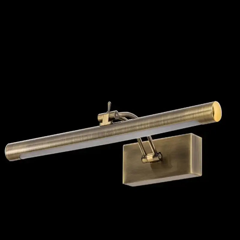 Antique brass-finished wall-mounted vanity mirror light with elongated cylindrical design and adjustable arm for bathroom use