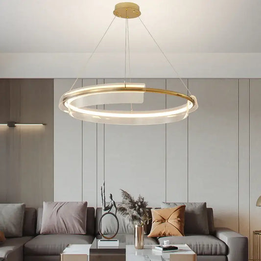 Modern gold ring chandelier pendant light with frosted glass and minimalist design for elegant dining room decorbites