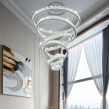 A modern gold decorbites crystal led chandelier with spiral clear crystal rings and polished metal for living room light