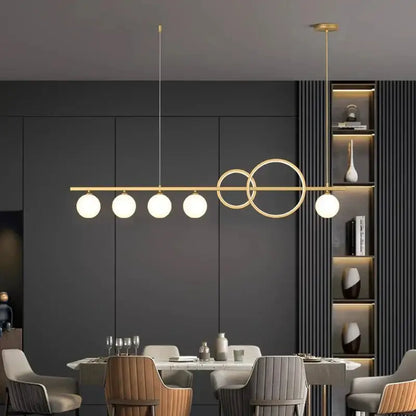 Modern gold-toned pendant light with five frosted glass bulbs and abstract metal design decorbites elegant chandelier dining