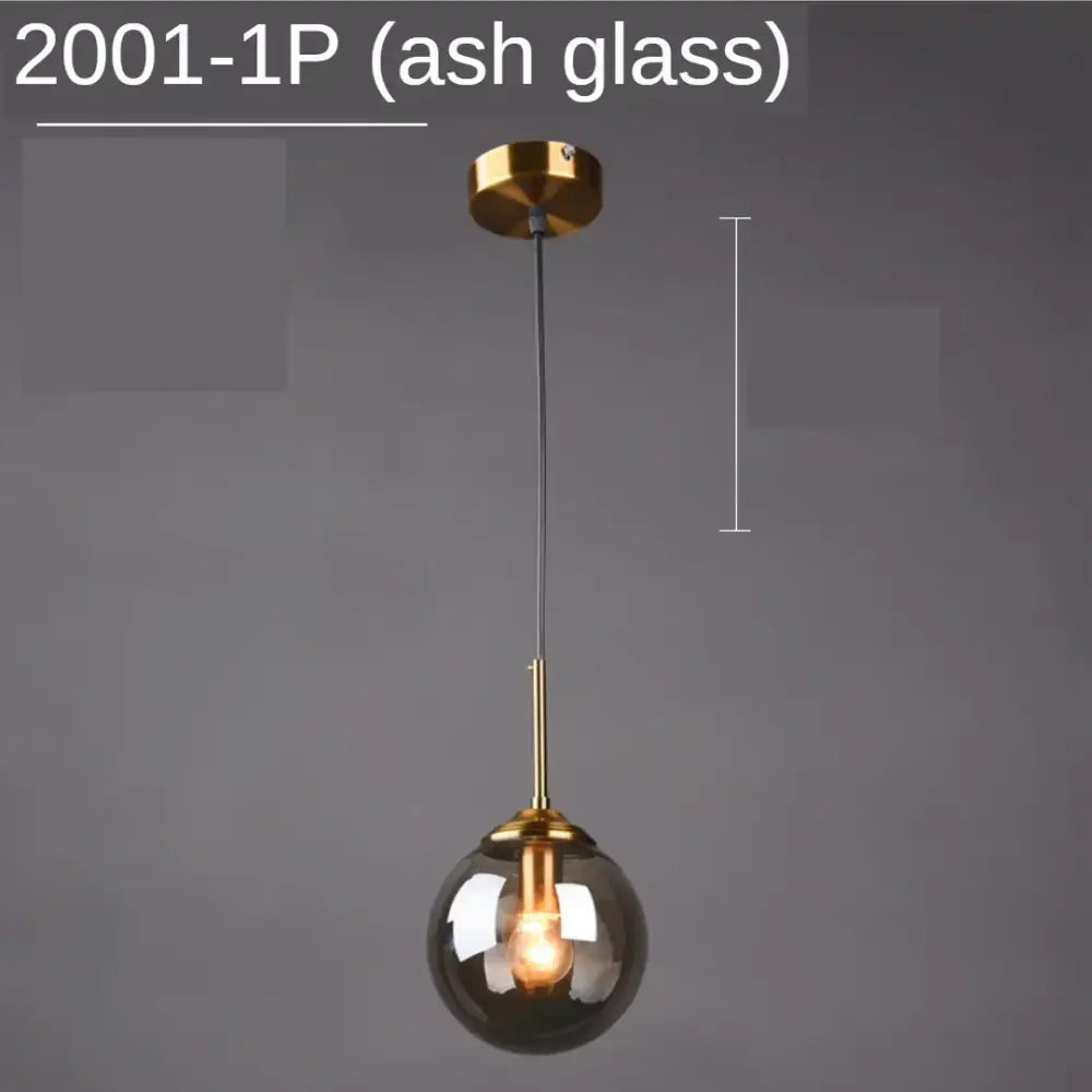 Modern gold ring glass globe pendant light with smoked ash glass globe and polished brass hardware for dining room