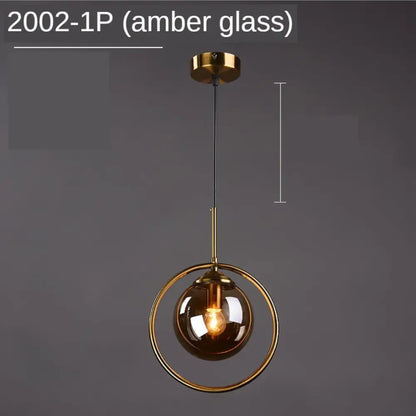 Modern gold ring glass globe pendant light with amber spherical glass globe and brass fixture for dining room lighting