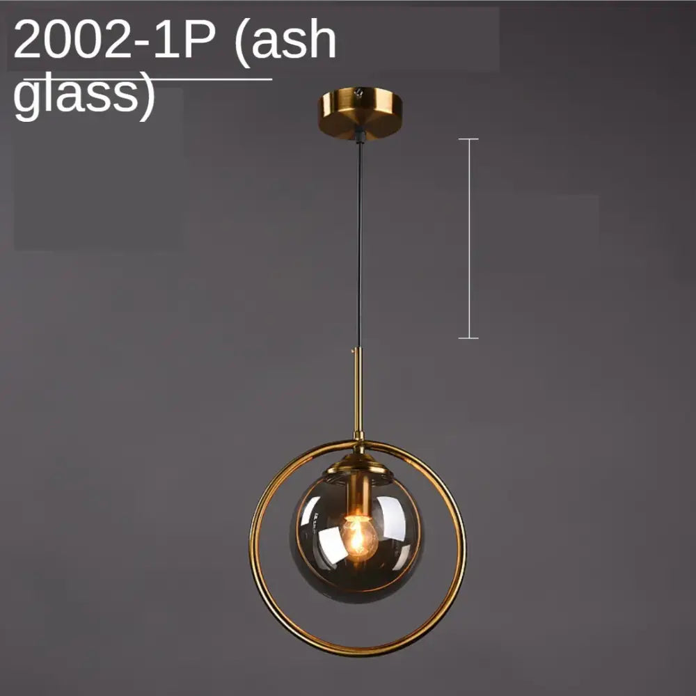 Modern gold ring glass globe pendant light with spherical ash glass globe and metallic ring for dining room