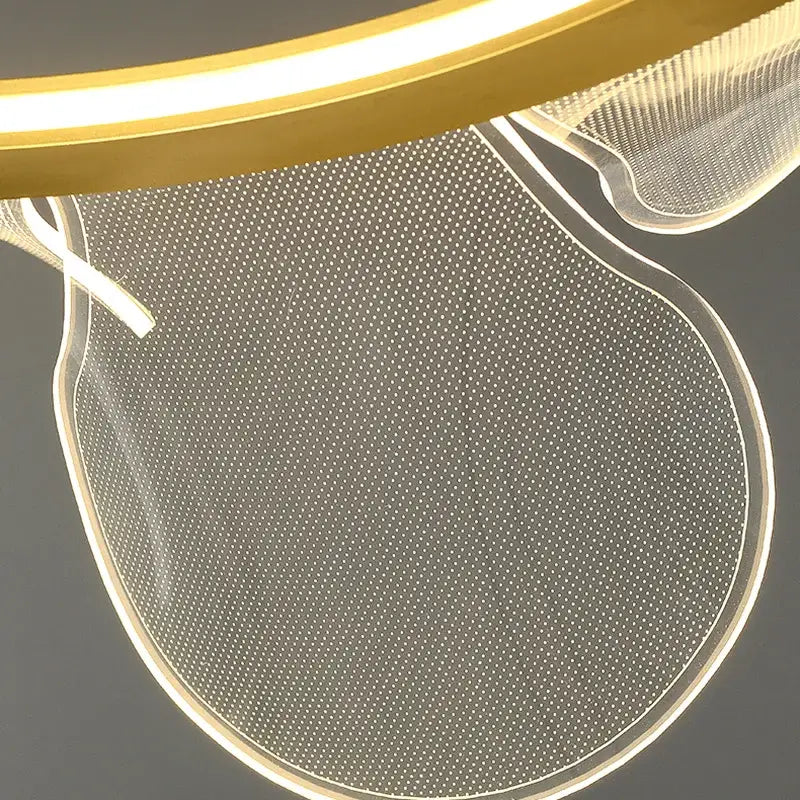 Modern gold ring led pendant light with a translucent perforated acrylic shade for warm dining room illumination decorbites gold ring
