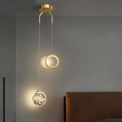 Modern gold ring led pendant light with sleek circular fixture and crystal globe for living room decorbites gold ring decor