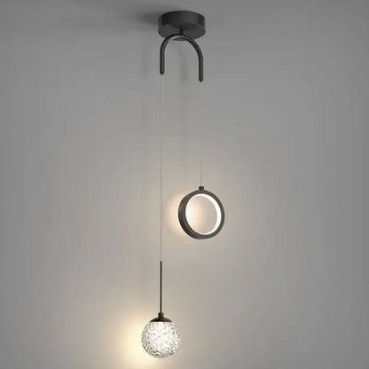 Modern black metal pendant light with a circular ring and faceted glass globe for decorbites gold ring led lighting