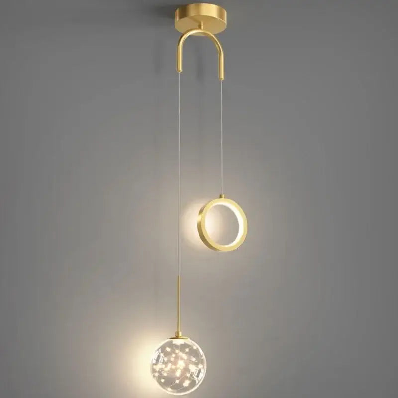 Modern gold ring led pendant light with crystal globe featuring a gold-toned decorbites gold ring design for dining room decor