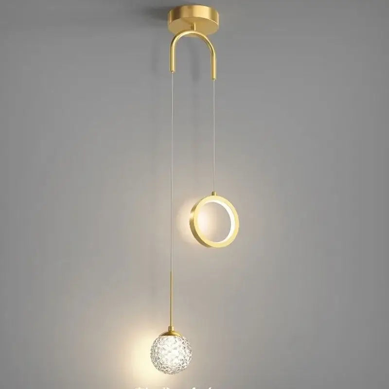 Modern gold ring led pendant light with decorbites gold ring features a curved mount, illuminated ring, and crystal globe