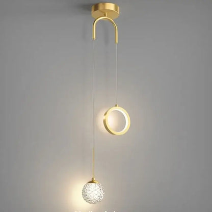 Modern gold ring led pendant light with decorbites gold ring features a curved mount, illuminated ring, and crystal globe
