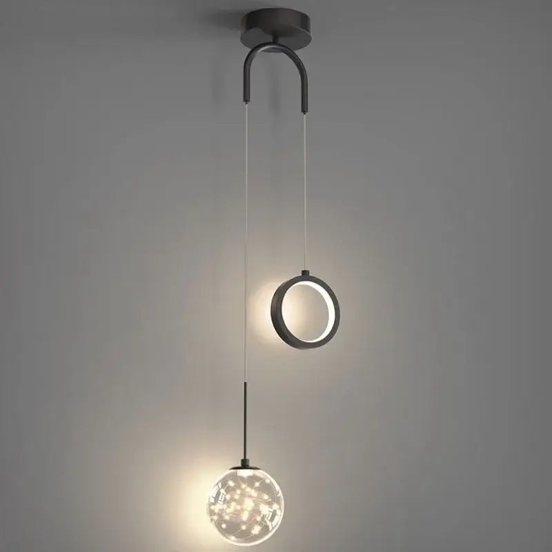 Modern black metal pendant light with a circular gold ring led and illuminated spherical globe for dining room decorbites gold ring