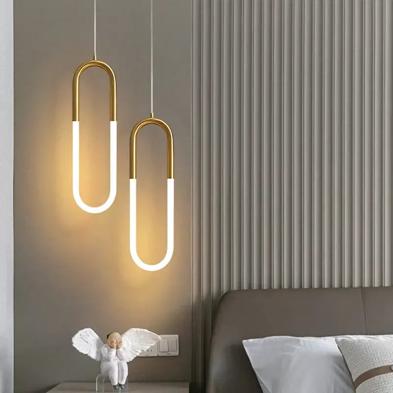 Two modern gold ring pendant lights with gold-toned metal frames and white led strips for dining room decorbites decor