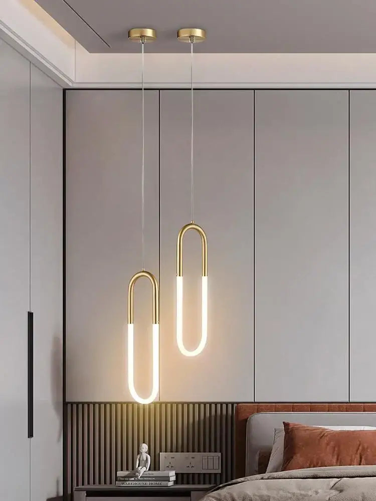 Modern gold ring pendant lights featuring gold-toned u-shaped LED illumination for minimalist dining room decorbites gold ring