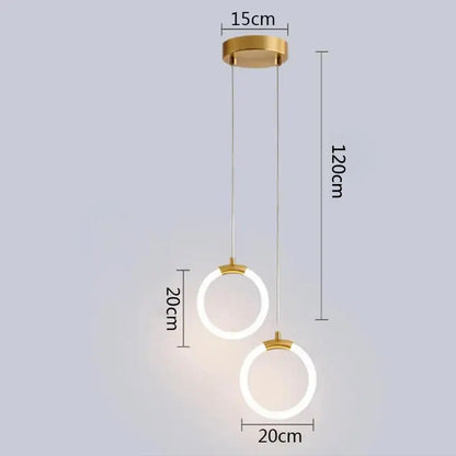 Modern gold ring pendant lights featuring two circular illuminated rings suspended by cords for dining room decorbites gold ring