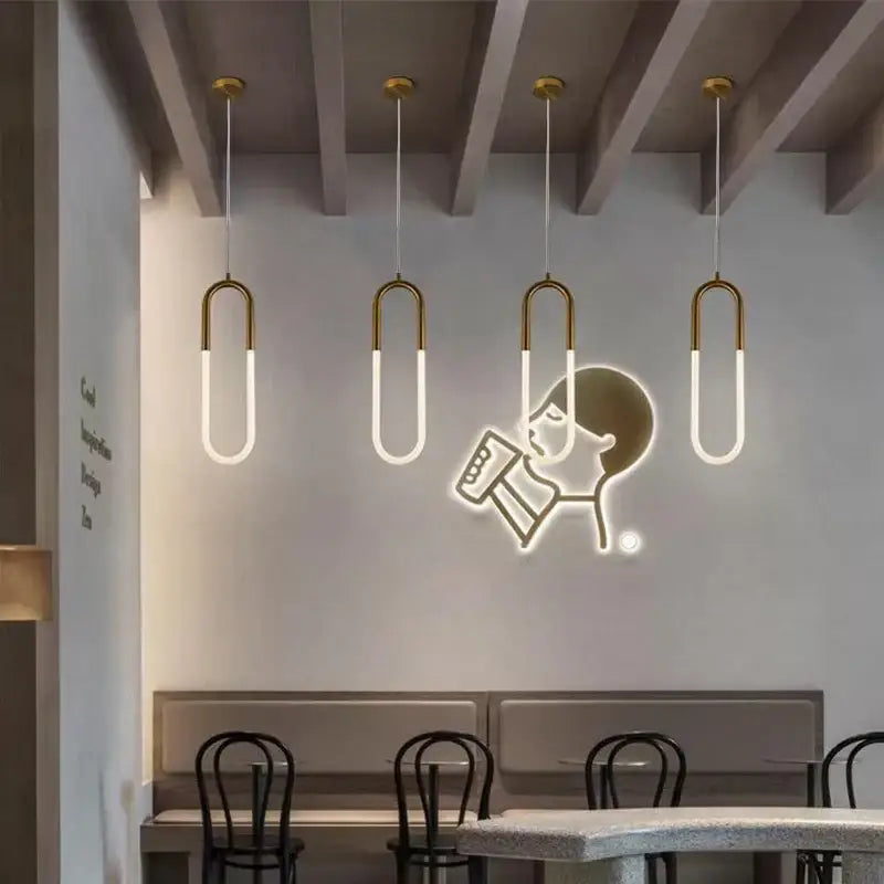 Four modern gold ring pendant lights with frosted glass shades and metal frames for dining room decorbites gold ring fixture