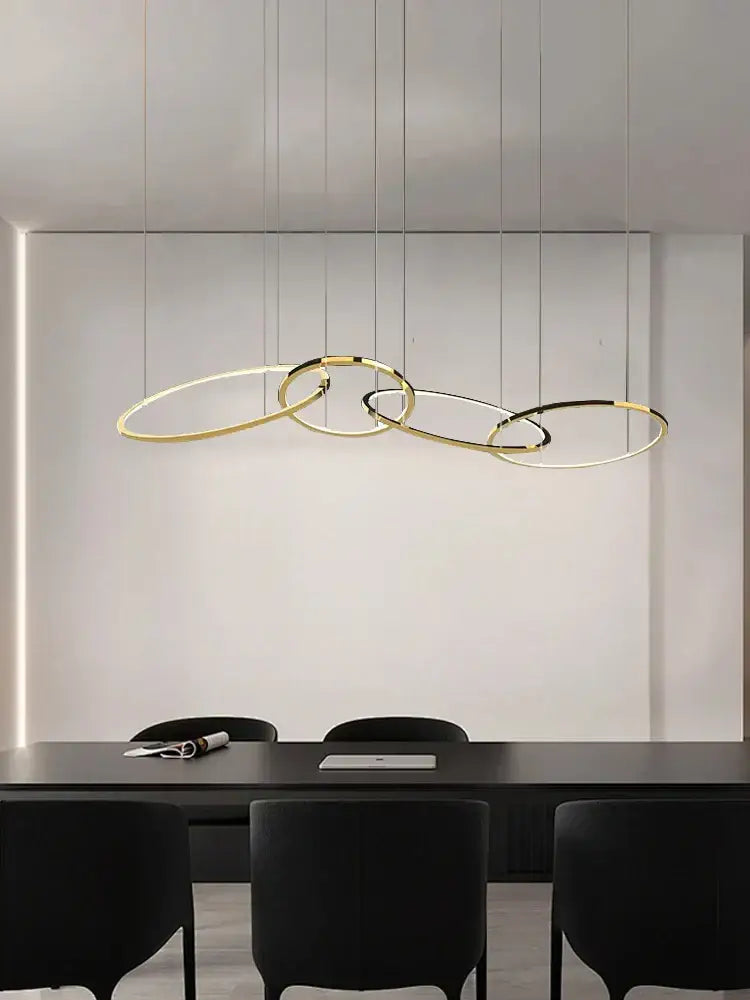 Modern gold round ceiling chandelier with sleek black interlocking rings for dining room decorbites gold round pendant light