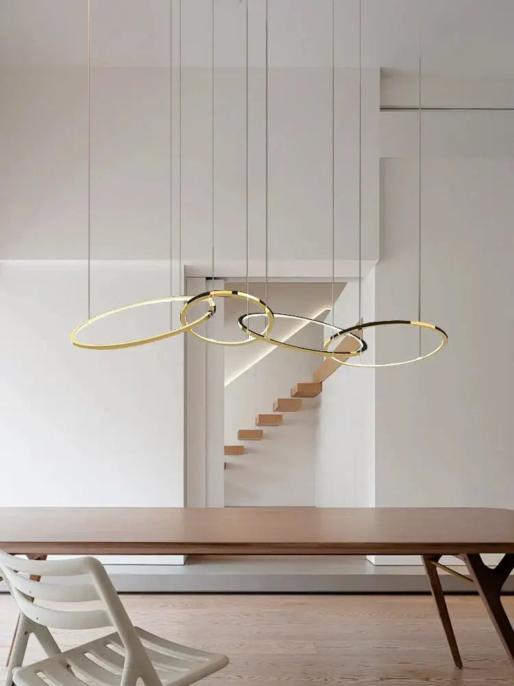 Modern gold round ceiling chandelier with sleek gold-toned circular pendant lights for dining room decorbites gold round design