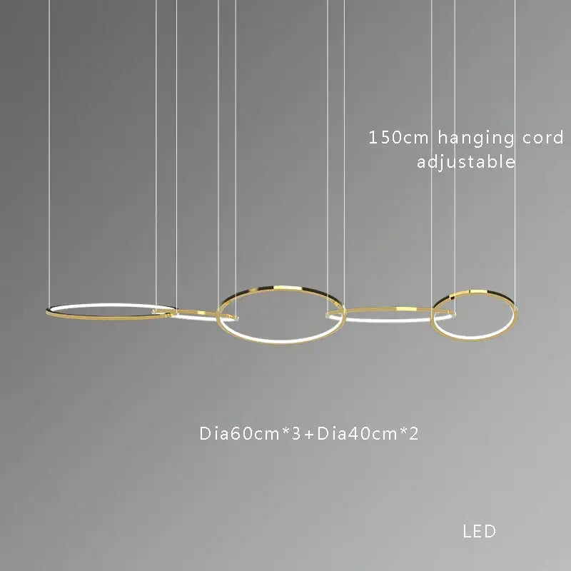 Modern gold round ceiling chandelier with three interconnected circular rings in gold-toned metal for dining room decorbites gold round