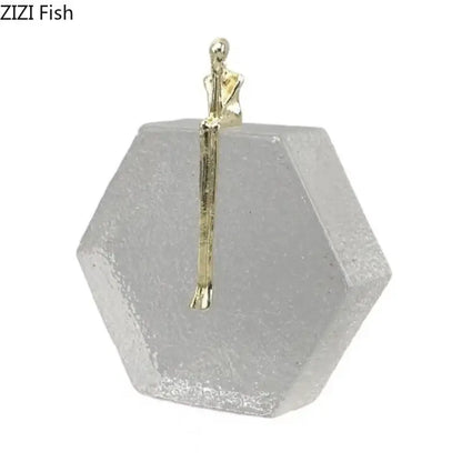 Modern gold runner crystal sculpture abstract statue featuring a gold-toned figurine on a hexagonal glass base decorbites crystal sculpture