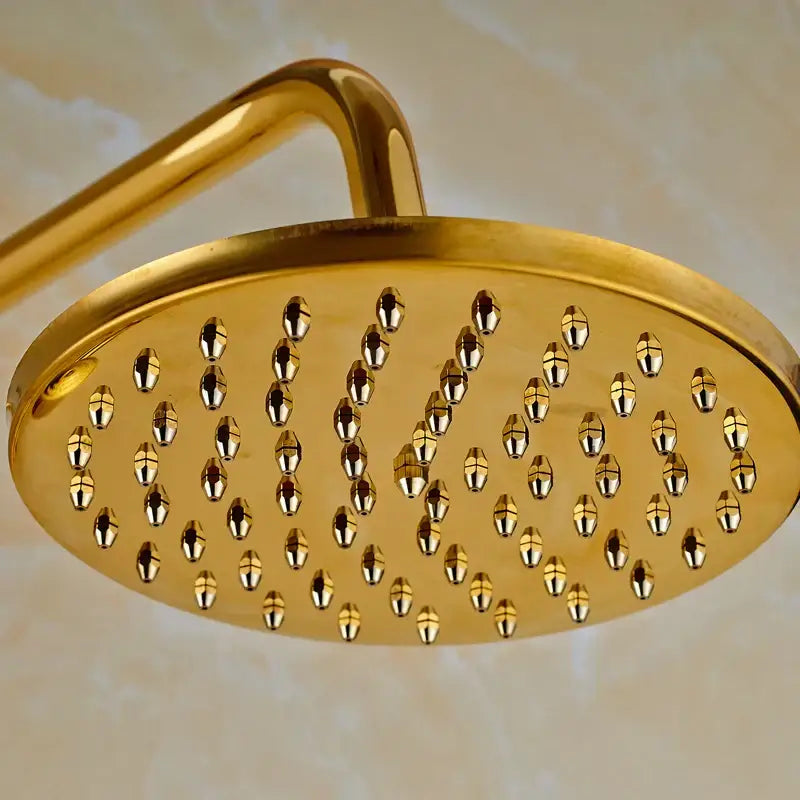 Modern gold shower mixer taps featuring a round rainfall head with polished metallic finish and multiple nozzles