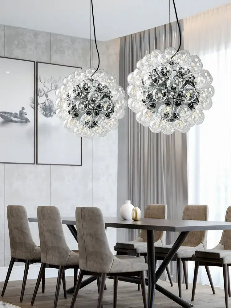 Modern gold and silver clear glass bubble chandelier with two clear glass bubble pendants for dining room lighting