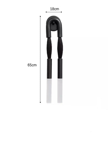 Black and white dual-ended tongs with curved handle 65cm length complementing decorbites designer tassel wall lamp