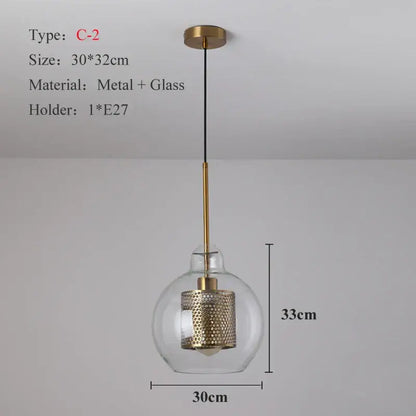 Modern gold and silver honeycomb glass pendant light with a ball glass pendant and perforated metal cylinder fixture