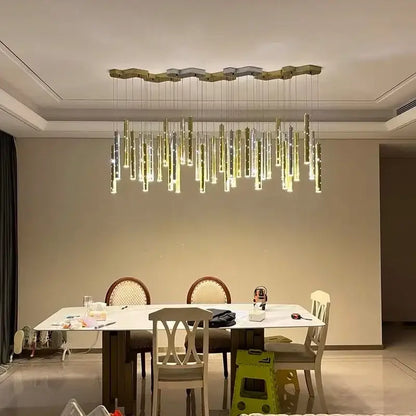 Modern gold and silver led pendant light chandelier with cascading cylindrical fixtures for dining room decorbites gold silver