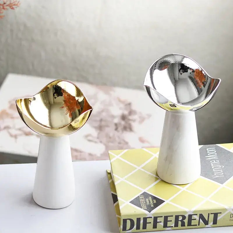 Two modern dessert bowls with gold and silver metallic tops on white marble bases from decorbites golden tray collection