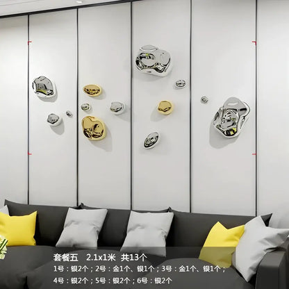 Modern gold and silver metallic rock wall hanging ornaments with a glossy reflective finish for living room decor
