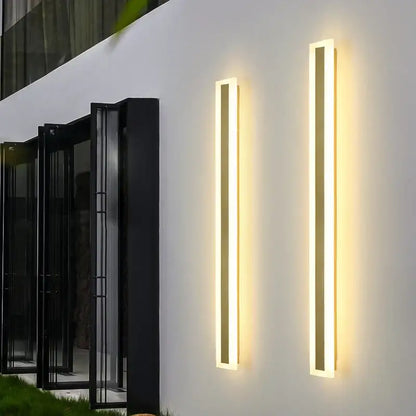Two modern gold slim led wall lamps with minimalist rectangular design and warm light for outdoor decorbites led wall use