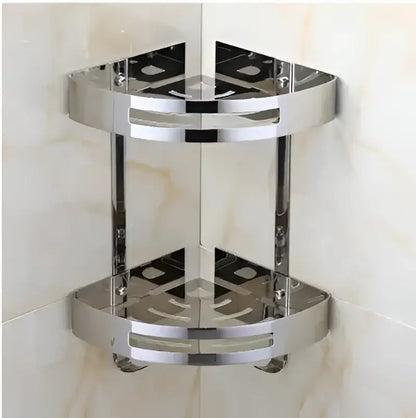 Shiny chrome-finished stainless steel double-tier corner shelf with circular cutouts for decorbites gold stainless style