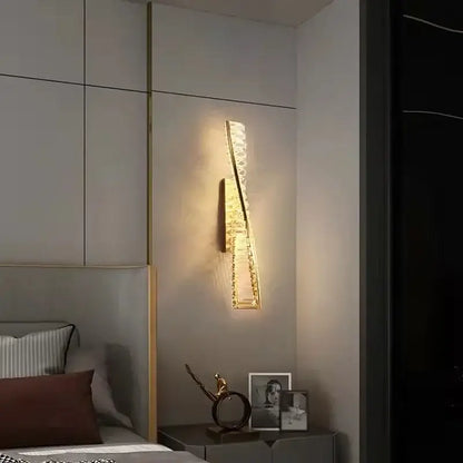 Modern gold steel led pendant light dining room crystal chandelier with gold-toned wall sconce and embedded crystals emitting warm light