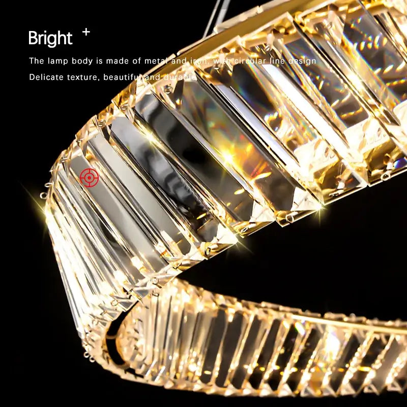 Modern gold steel rings pendant light with faceted crystal panels refracting rainbow hues for dining room use