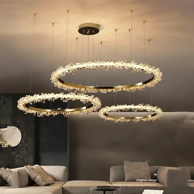Modern gold swirling crystal pendant chandelier with concentric rings and sparkling accents for elegant dining decorbites crystal pendant