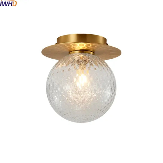 Modern gold textured glass ceiling lamp with a clear textured globe by decorbites iron for living room lighting