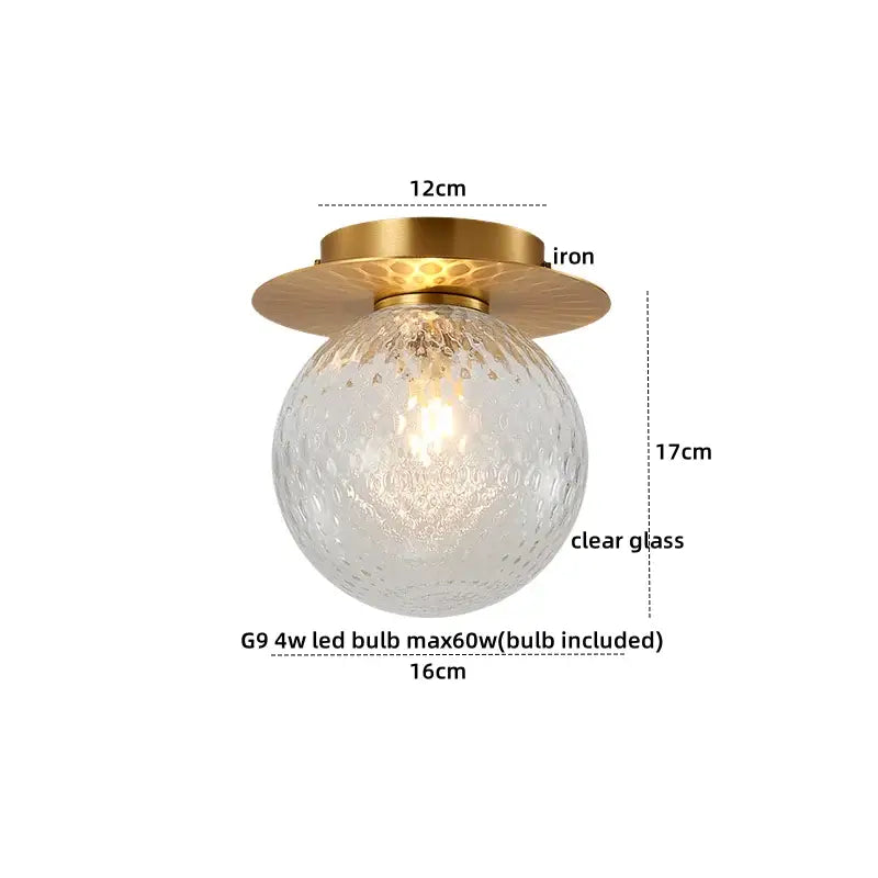 Modern gold textured glass ceiling lamp with a round clear globe and brass decorbites iron glass base for living room decor