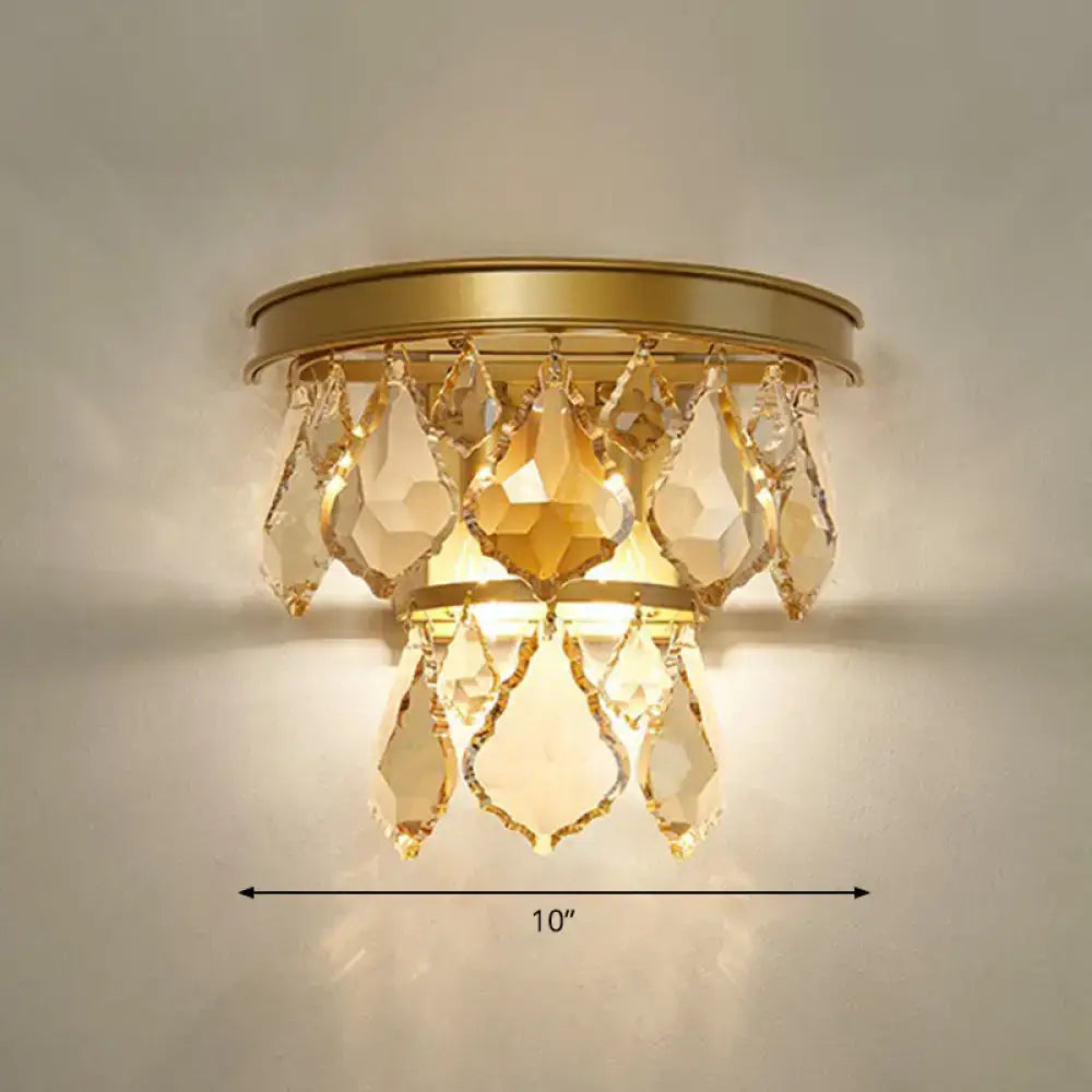 Modern gold tiered sconce light fixture with faceted teardrop crystals bedside wall mount for bedroom use