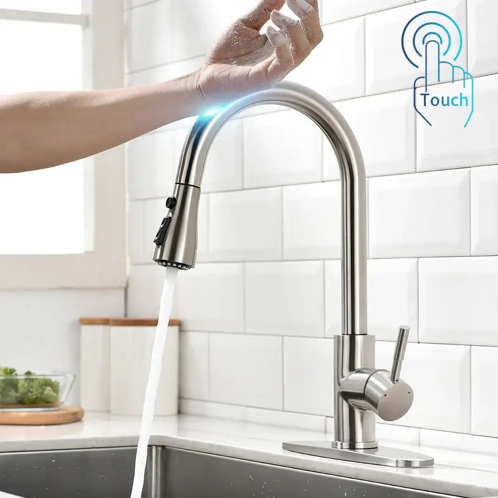 Modern gold touch control sink tap with a stainless steel curved spout and pull-down spray head for kitchen use