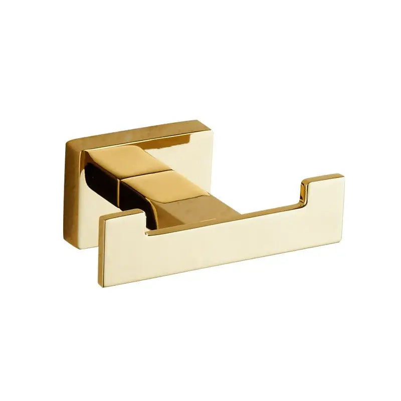 Modern gold towel ranger accessory rack featuring a gold-finished double toilet paper holder with polished metal surface