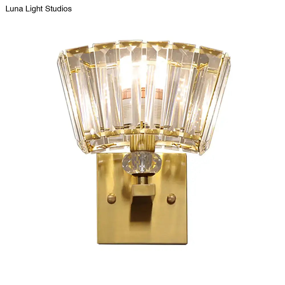 Modern gold wall sconce with faceted crystal blocks shade and central decorative crystal knob for living room lighting