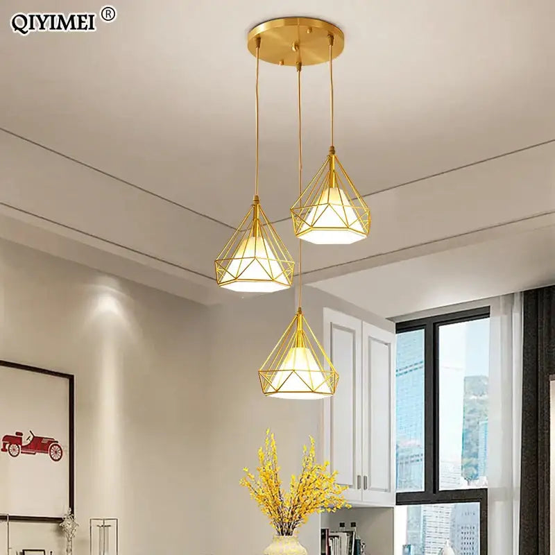 Modern gold triangle pendant lights with a faceted geometric design ideal for dining room decorbites gold triangle fixture