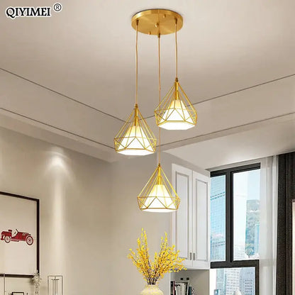 Modern gold triangle pendant lights with a faceted geometric design ideal for dining room decorbites gold triangle fixture