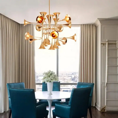 Modern gold trumpet pendant chandeliers featuring golden brass and glowing amber glass globes for dining room decorbites gold trumpet