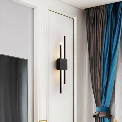Black modern wall sconce with sleek vertical bars and square base for decorbites gold tube wall lighting decor