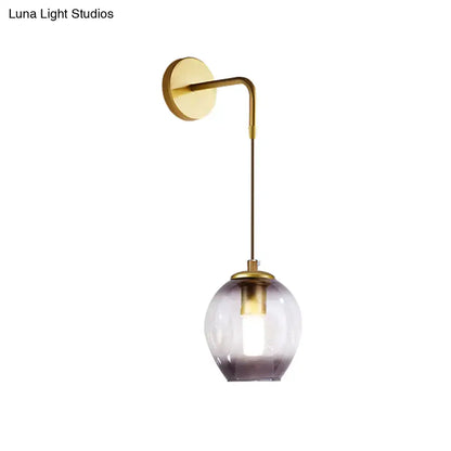Modern gold tulip wall lamp with brass arm and purple glass shade for bedroom as a stylish wall lamp feature