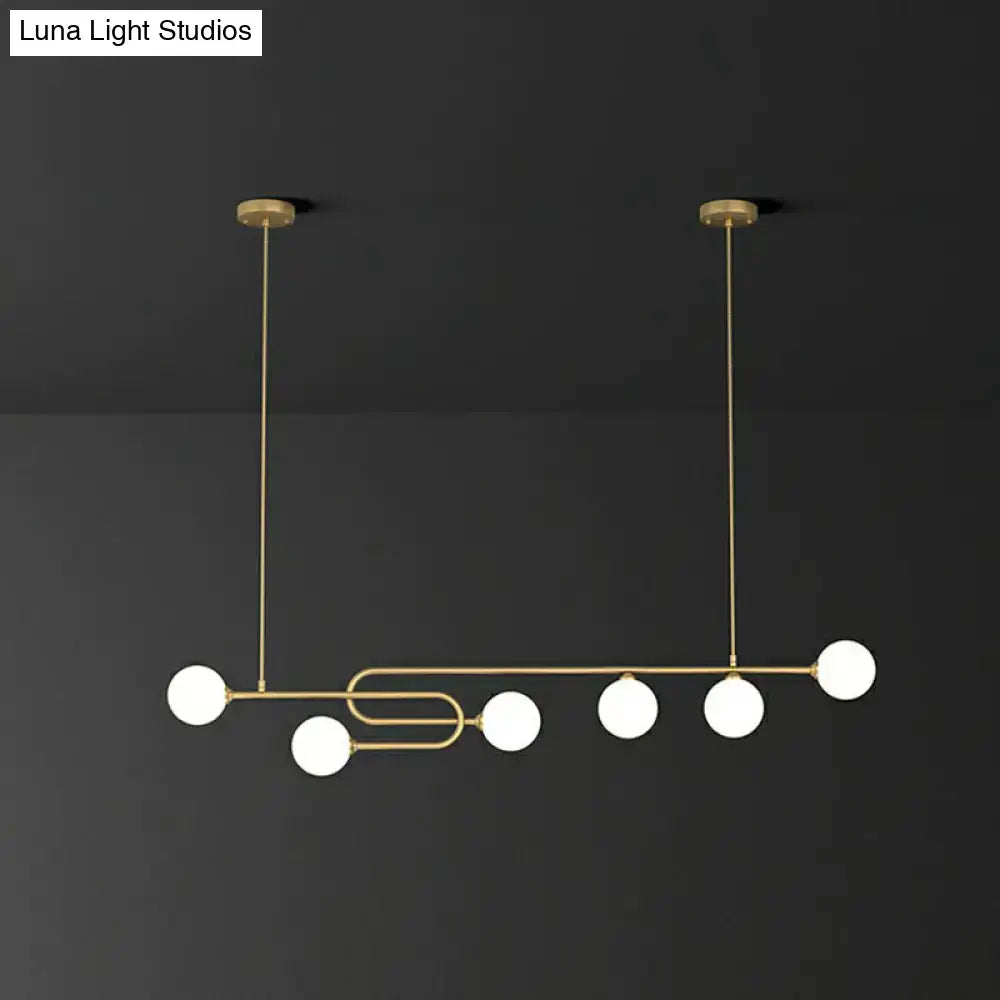Modern gold-toned pendant light with five frosted glass shade globes for dining room island 110v-120v 220v-240v use