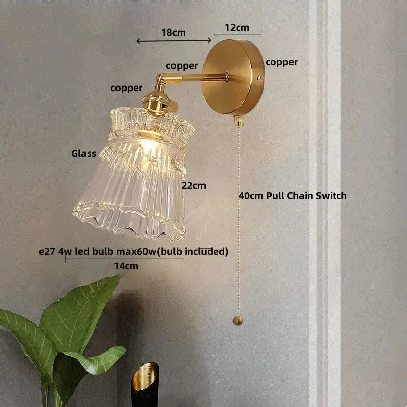 Modern gold wall lamp with brass copper arm and decorbites clear glass shade for warm bedroom lighting pull chain
